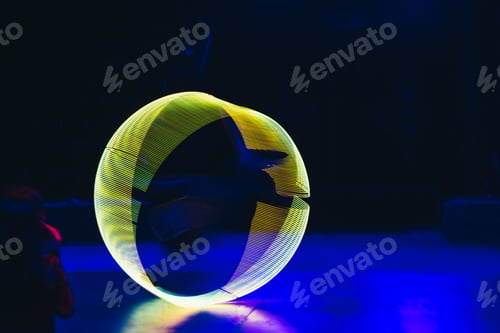 Preview: Green neon light in circle shape on dark background