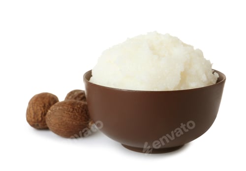 Preview: Shea butter in bowl and nuts isolated on white