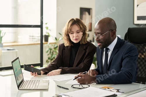 Preview: Business Colleagues Working With Financial Reports