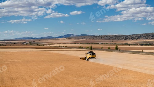 Preview: a field machine working a cereal field