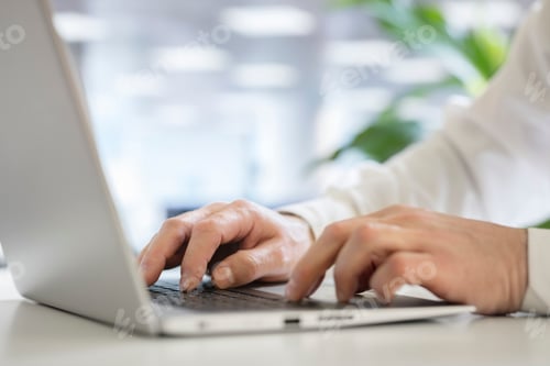 Preview: Hands typing on laptop computer