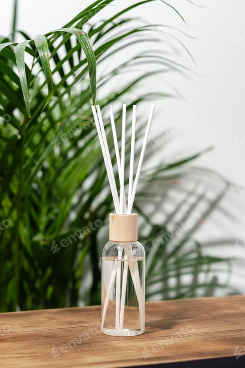 Preview: Glass Diffuser Bottle With Wooden Sticks on Wooden Tabletop