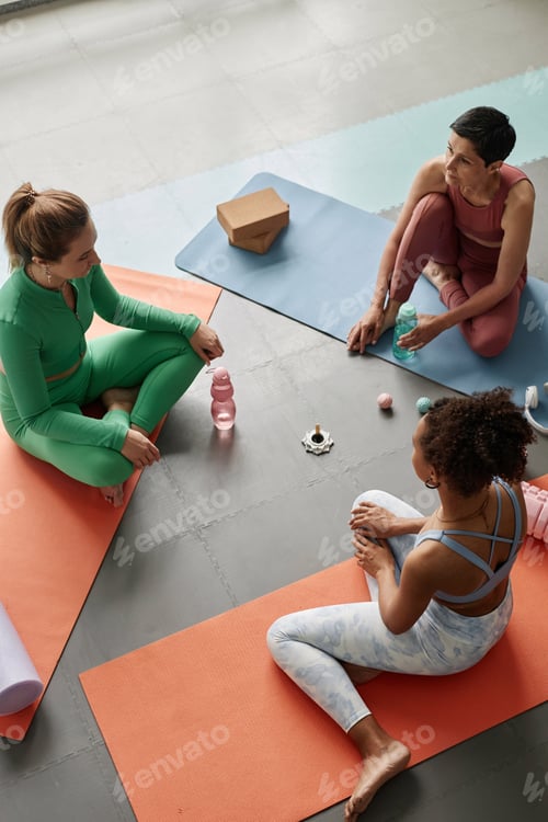 Preview: Group of Women Working Out Together and Sitting in Circle