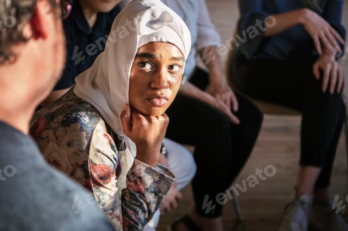 Preview: People listening to a speaker in a rehab session