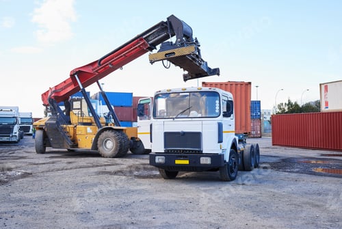 Preview: Truck, logistics and supply chain with a construction driver on a commercial container yard for shi