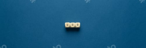Preview: BRB abbreviation spelled on wooden dices