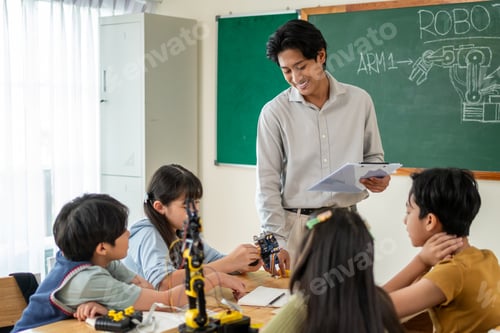 Preview: Group of students learning in a robotics class at elementary school.