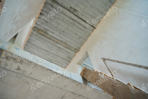 Preview: Photo of stairs to the second floor in unfinished house