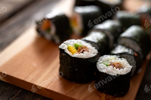 Preview: Fresh sushi rolls on wooden board