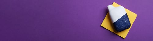 Preview: disposable electronic cigarette or vape on purple background. top view copy space.