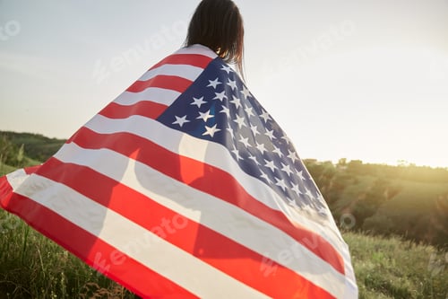 Preview: 4th of July. American woman with the national American flag