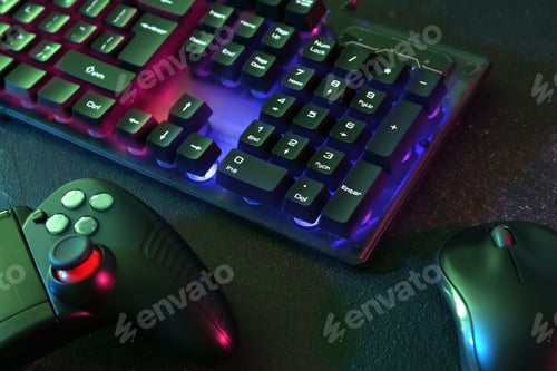 Preview: Modern RGB keyboard, mouse and video game controller on grey table, closeup