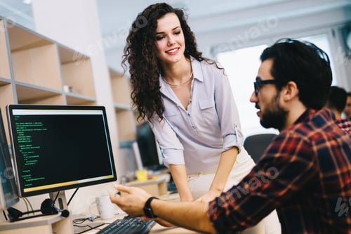 Preview: Programmers cooperating at information technology company