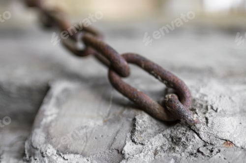 Preview: Rusty Old Chain on a Concrete Block