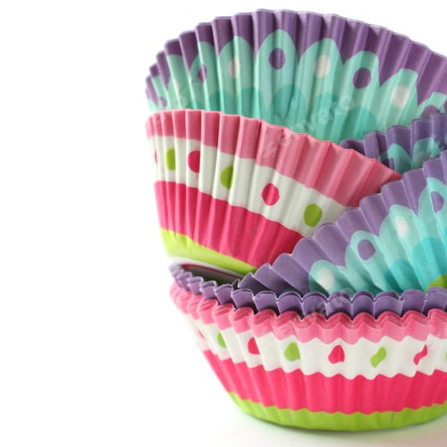 Preview: Colorful Cupcake Liners Stacked on White Background