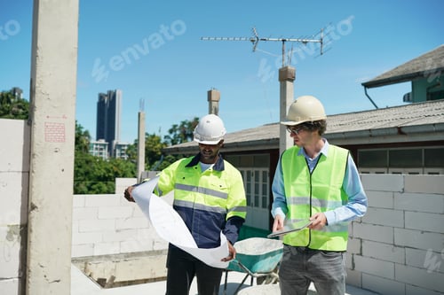 Preview: Architect and construction engineer or surveyor discussion plans and blueprints