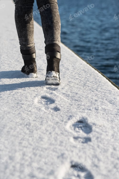 Preview: Taking a winter walk along a snowy path.