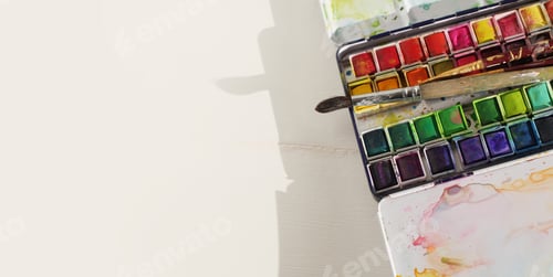 Preview: Watercolor palette and paintbrush on white artistic workshop background. Flat lay, top view.