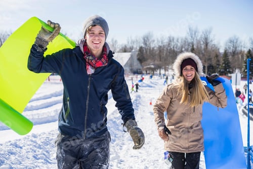 Preview: Two beautiful friends playing in the snow with crazy carpets, Montreal, Quebec, Canada