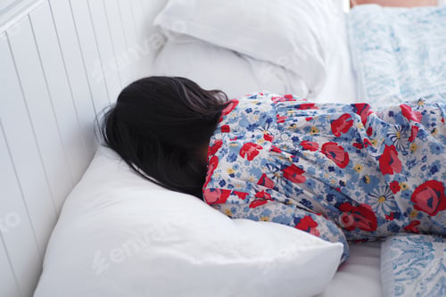Preview: a child sleeping on bed