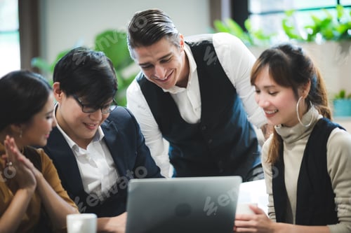 Preview: success and winning concept - happy business team celebrating victory in coworking space