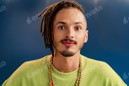 Preview: Close-up portrait of a young stylish man with dreadlocks
