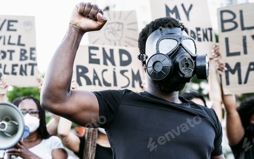 Preview: Activist wearing gas mask protesting against racism and fighting for equality