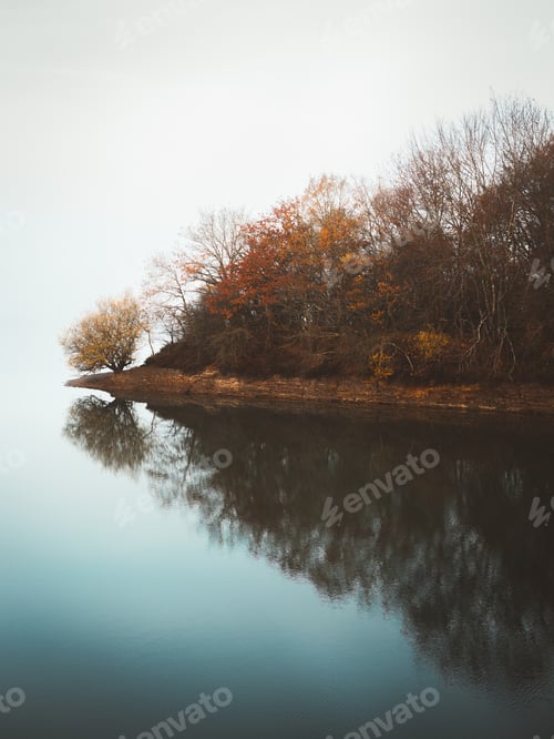 Preview: Tranquil water of lake in mist