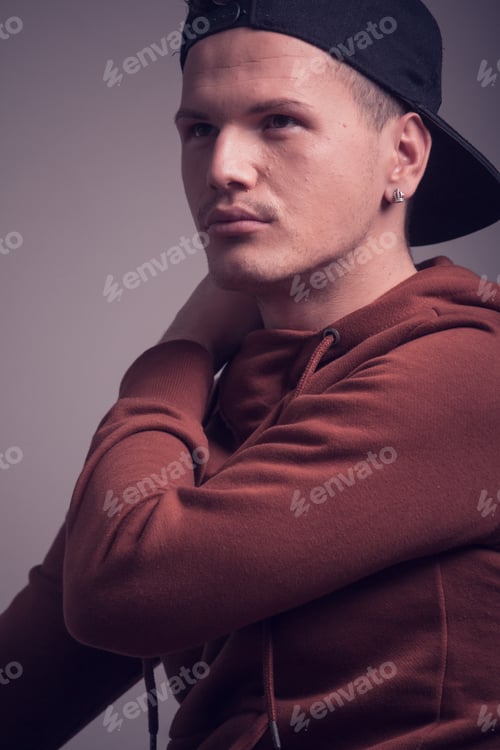 Preview: One Young Man, Early 20S, Boyish Looks, Posing In Studio, Casual Clothes, Sweatshirt Cap, Upper