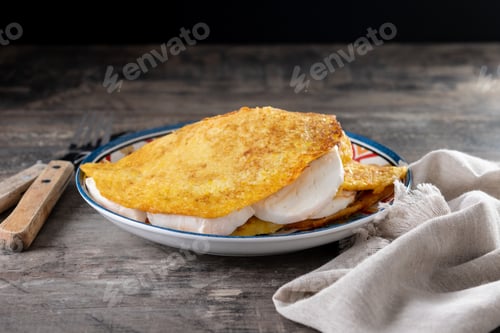 Preview: Traditional Venezuelan beef cachapa on wooden table