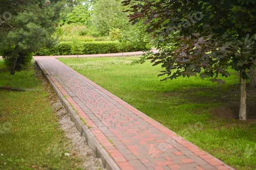 Preview: the path is lined with bricks in the park