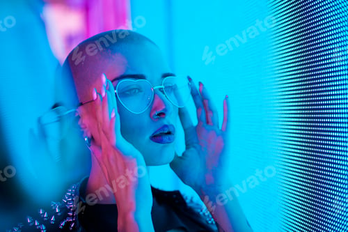 Preview: Beautiful woman illuminated by led lights
