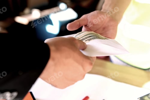 Preview: Close up hand of owner giving money to employee or hired person for his wage or salary over table.