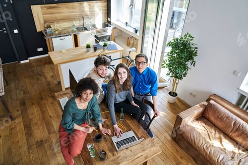Preview: Elevated view of smiling coworkers in office