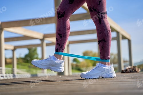 Preview: Legs Exercising with Resistance Band on Bridge