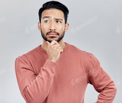 Preview: Confused, thinking and Asian man with ideas, decision and thoughtful against grey studio background