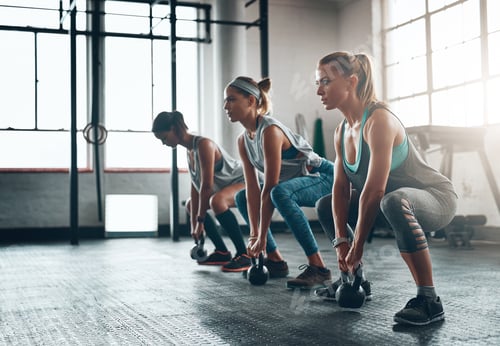 Preview: You are stronger than your challenges. Shot of three young women working out together.