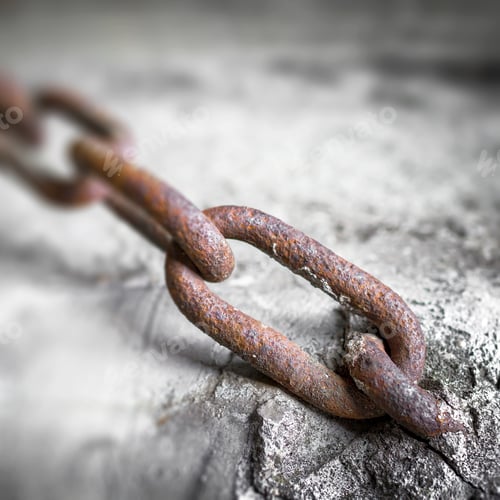 Preview: Rusty chain into the concrete