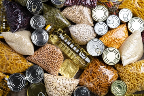 Preview: Donations food with canned food on the table background. Donate concept.