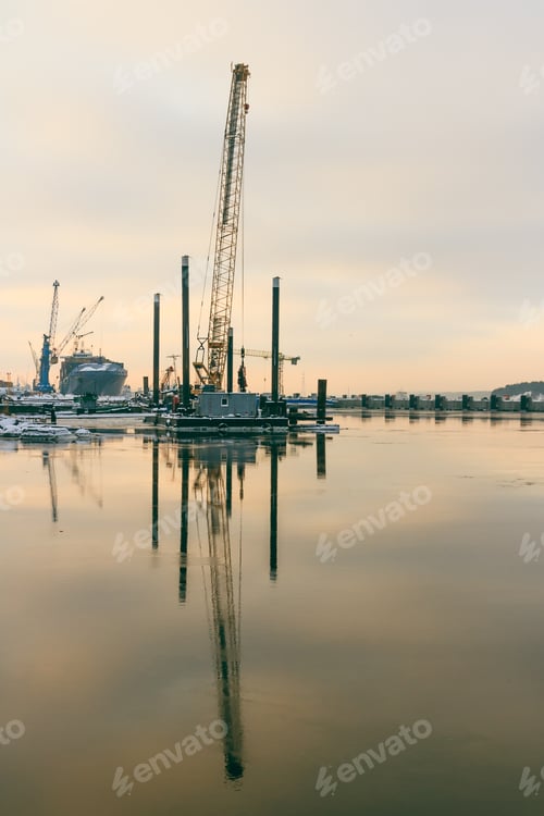 Preview: Beautiful view of a cloudy blue sky reflecting on water in Port of Klaipeda, Lithuania with ships