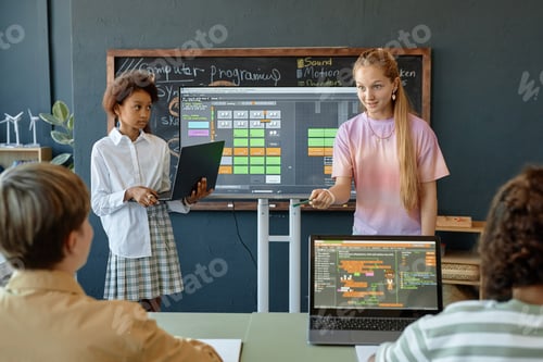 Preview: Two Teen Girls Giving Presentation on IT in Class