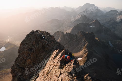Preview: Two mountaineers climb roped together along a ridge of Pico Gran Facha in the Pyrenees