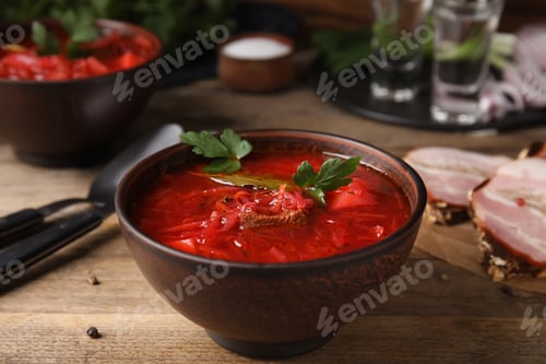 Preview: Stylish brown clay bowl with Ukrainian borsch served on wooden table