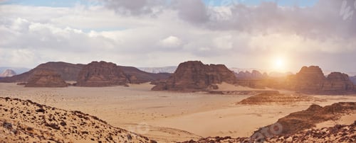 Preview: Valley in the desert with mountains at sunset