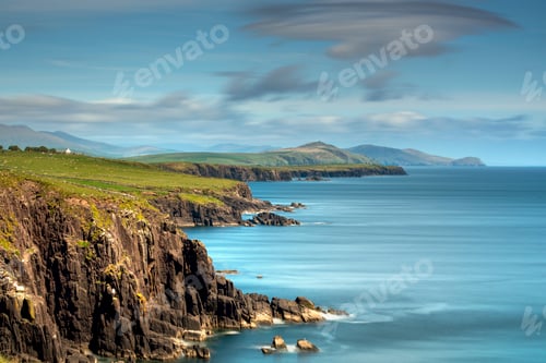 Preview: Scenic coastal landscape with serene sky and rugged cliffs