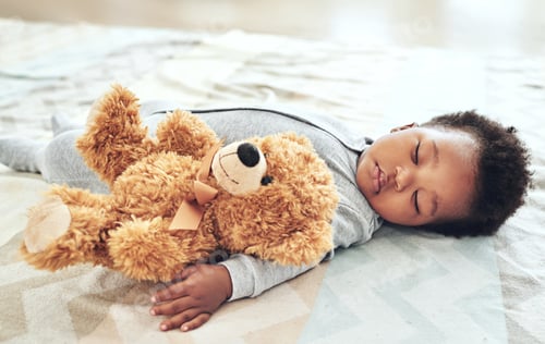 Preview: Shot of a baby boy asleep with his teddy bear in his arm