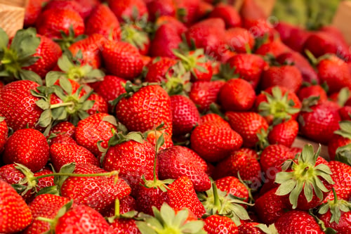 Preview: Vivid colorful red strawberries on the fruit market