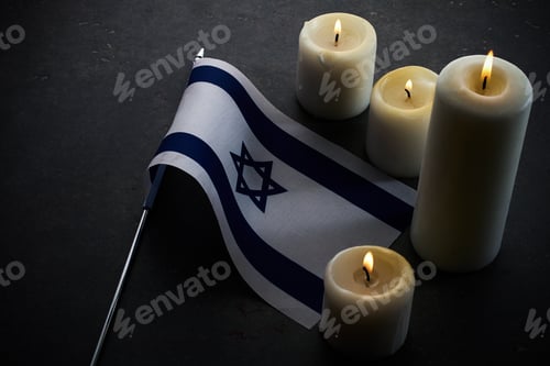 Preview: Burning candles and flag of Israel on dark background. Holocaust remembrance day