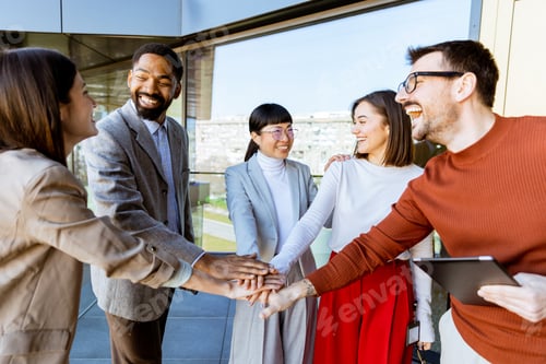 Preview: Team members celebrate success with joyful handshakes and smiles under bright city skies