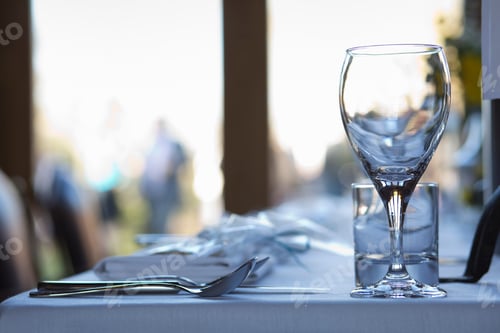 Preview: Close up of crockery and cutlery on a table.